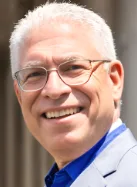 Ernie smiling in a professional headshot, online entrepreneur and business owner